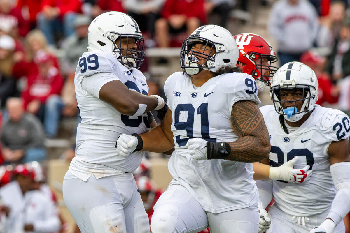 Penn State defensive tackle Dvon Ellies (91) reacts after taking Indiana quarterback Jack Tuttle (14) during an NCAA college football game, Saturday, Nov. 5, 2022, in Bloomington, Ind. (AP Photo/Doug McSchooler)