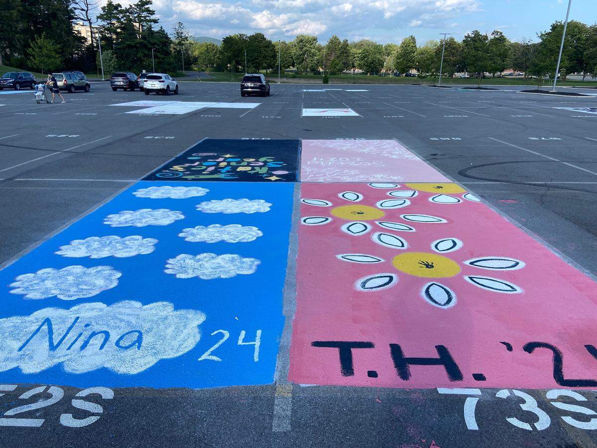 Parking spots decorated by seniors at the State High senior lot on Wednesday, Aug. 18, 2023.