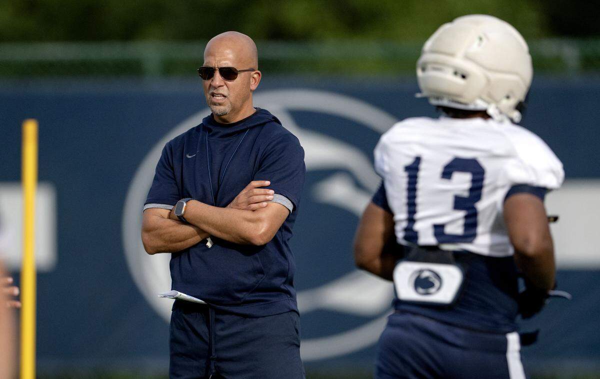 Penn State football coach James Franklin watches players run a ball security drill during practice on Tuesday, Sept. 16, 2025.  