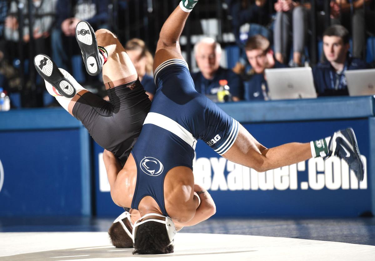 Penn State’s Roman Bravo-Young, 133 lbs, (front) lifts Arizona State’s Ryan Millhof off the matt for a take-down Friday at Rec Hall in State Bravo-Young won, 14-1. College. Penn State defeated Arizona State, 41-3. (For the CDT/Steve Manuel)