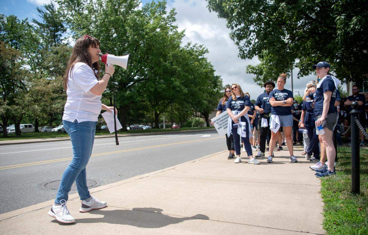 Rebecca Geiger from the Penn State Gender Equity Center talks to the crowd before the “Roar and Rally” walk to celebrate the 50th Anniversary of Title IX on Thursday, June 23, 2022.