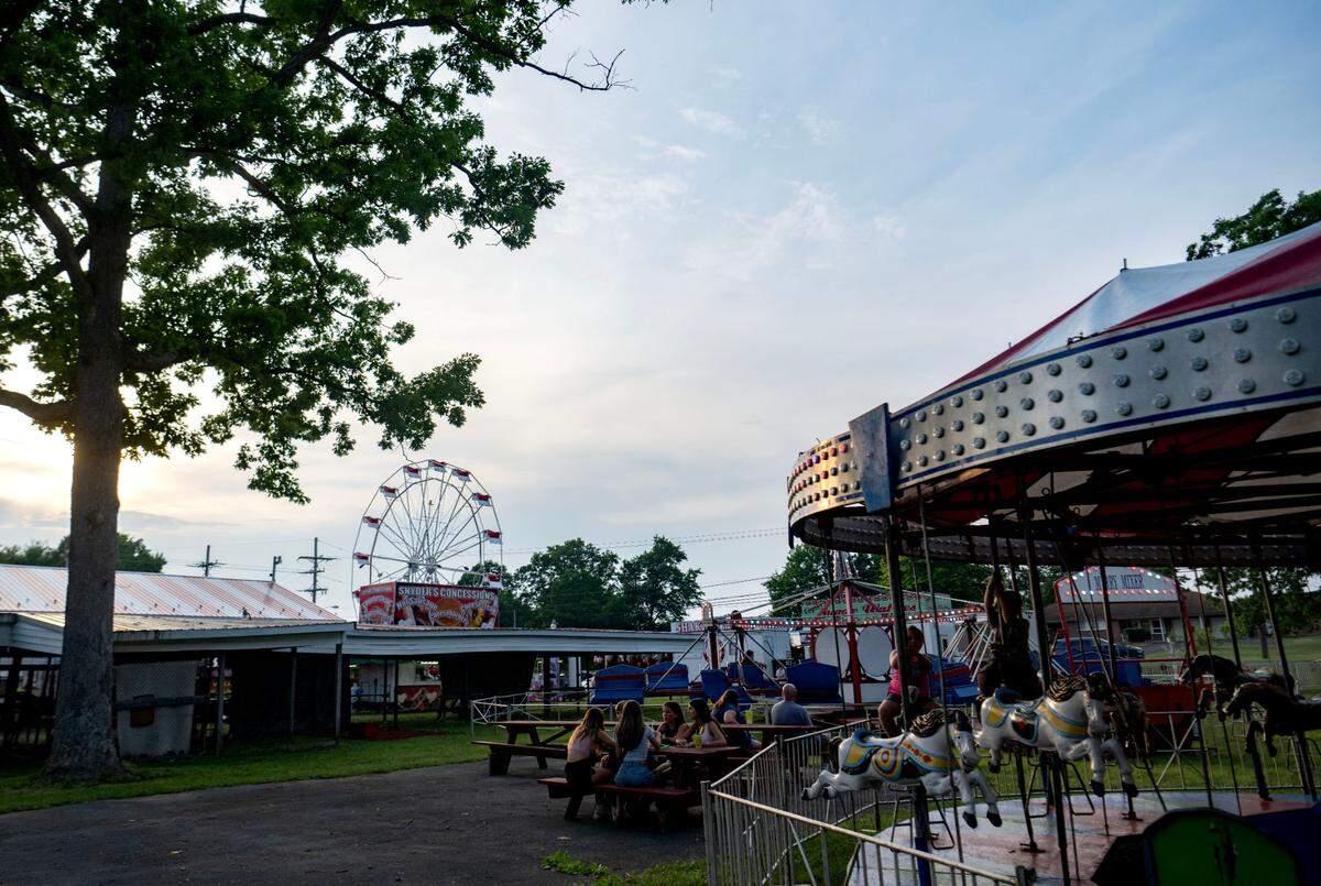 The sun starts to set over the Snow Shoe Carnival on Tuesday, June 18, 2024.