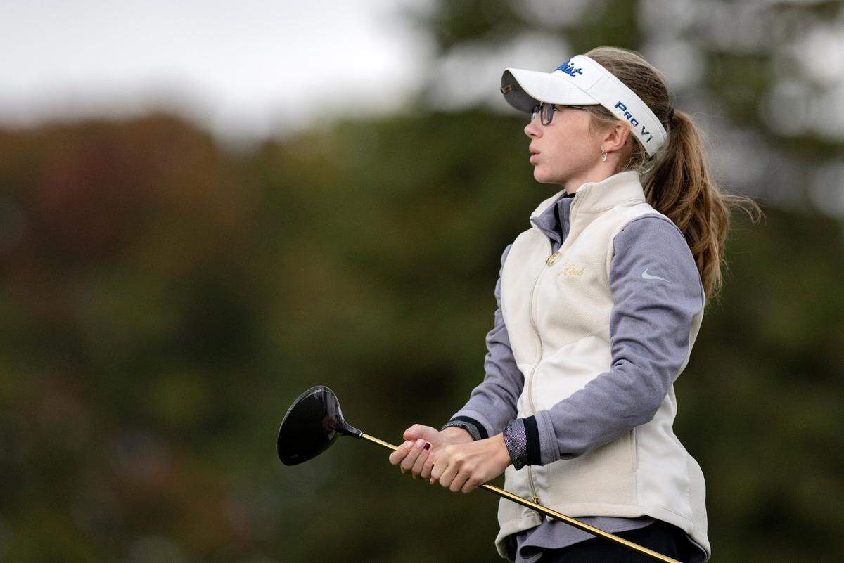 Saint Joseph’s Catholic Academy’s Maddie Koshko watches her tee shot during the PIAA golf championships on Monday, Oct. 17, at the Penn State Golf Courses.