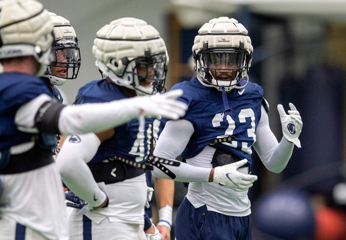 Penn State linebacker Curtis Jacobs and his teammates talk about a drill during practice on Friday, Dec. 17, 2021.