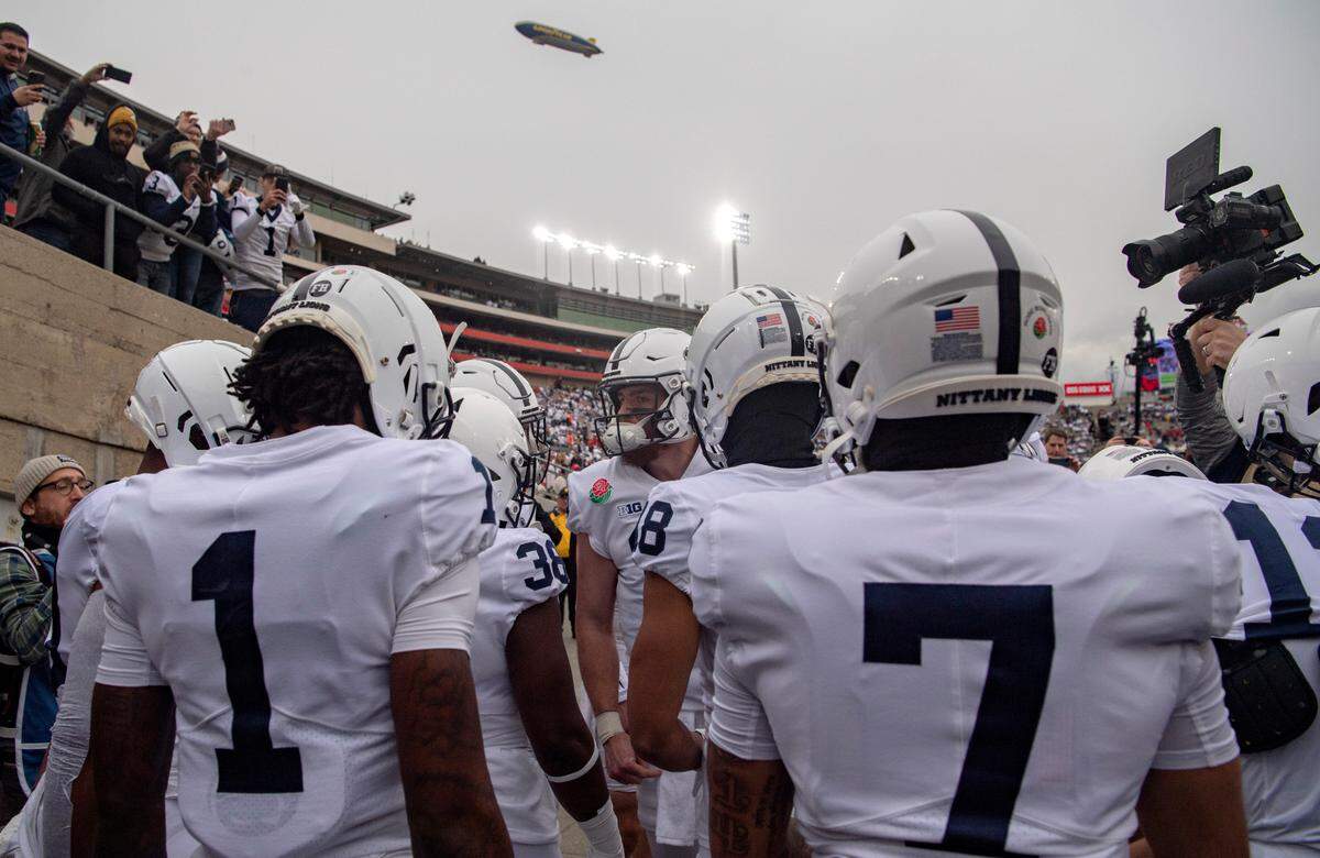 Penn State quarterback Sean Clifford pumps up members of the offense as they got out for warmups for the Rose Bowl against Utah on Monday, Jan. 2, 2023.