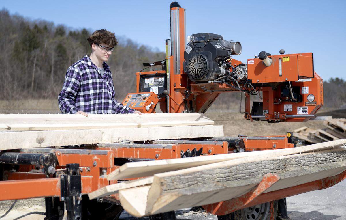 Senior Carnell Noone mills wood outside the new forestry building on Thursday, Feb. 26, 2026. 