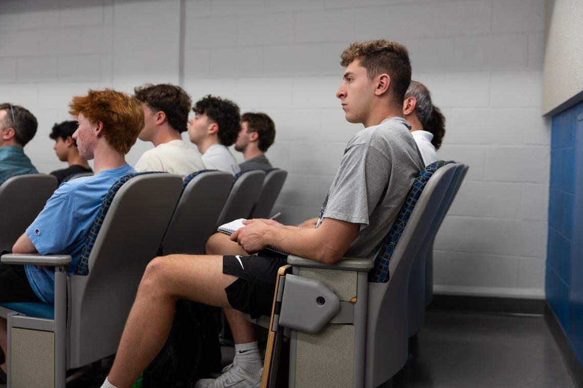 Nico Rodrigues, a fourth-year journalism student, listens during a debate over whether college athletes should be paid in University Park, Pa., on Thursday, April 16, 2026. The debate was hosted by Penn State’s College of Health and Human Development.