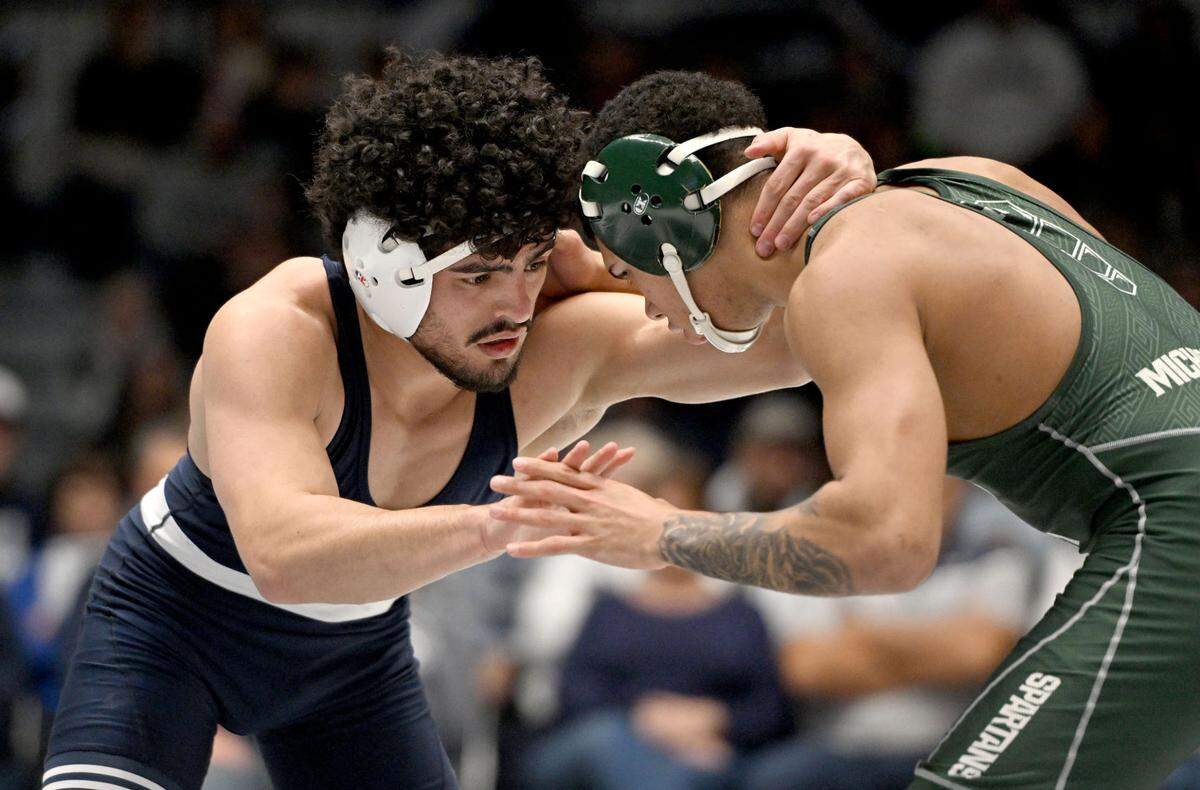 Penn State’s Beau Bartlett wrestles Michigan State’s Jaden Crumpler in the 141 lb bout of the match on Friday, Jan. 10, 2025 in Rec Hall. Bartlett won by major decision, 12-3.