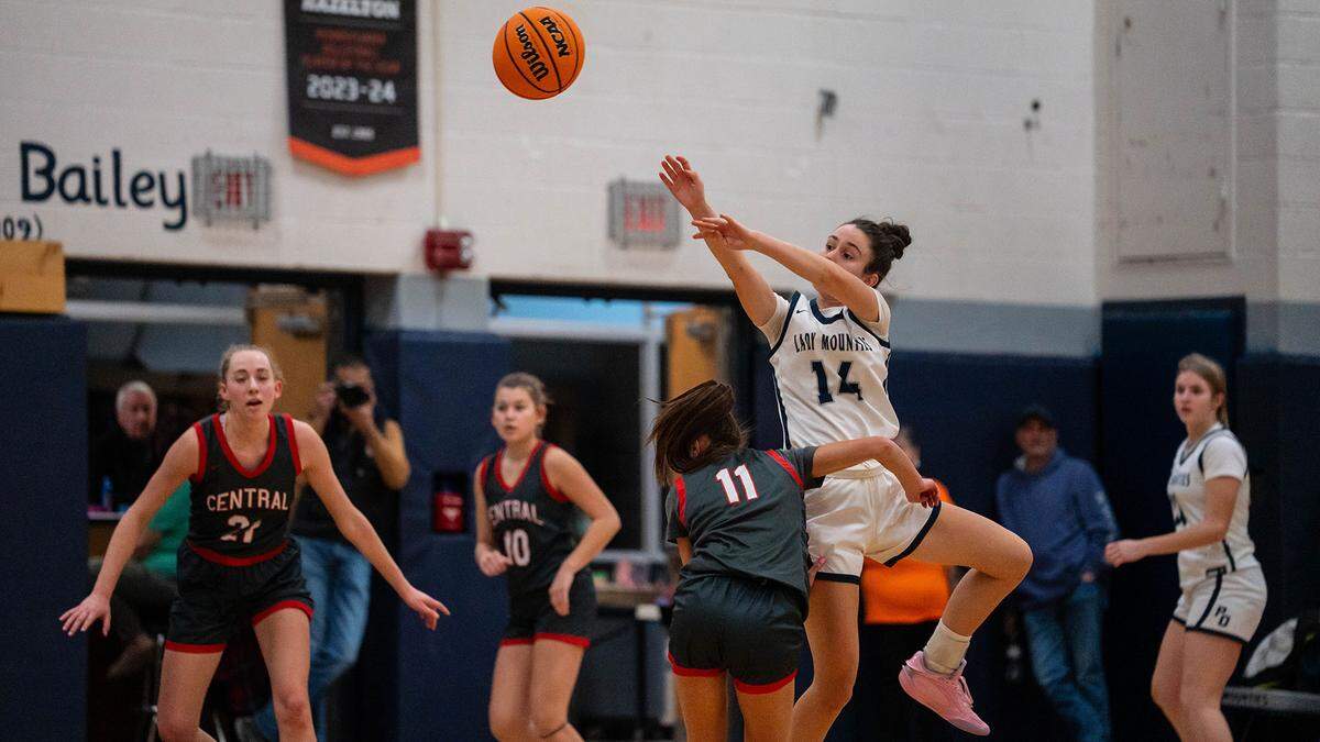 Philipsburg-Osceola senior Emily Gustkey (14) attempts a contested shot during a basketball game against Central in Philipsburg, Pa., on Monday, Feb. 9, 2026. The Mountaineers lost to the Dragons 48-15.