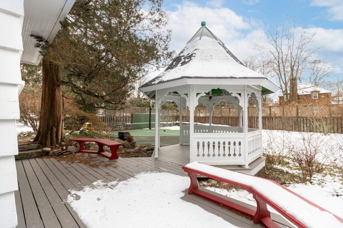Another amenity offered by the home is a full deck out back with a gazebo, seen here.