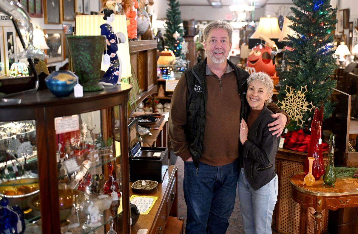 Mitch and Lynne Bradley stand among the pieces at Victorian House Antiques in Bellefonte on Thursday, Jan. 9, 2025.