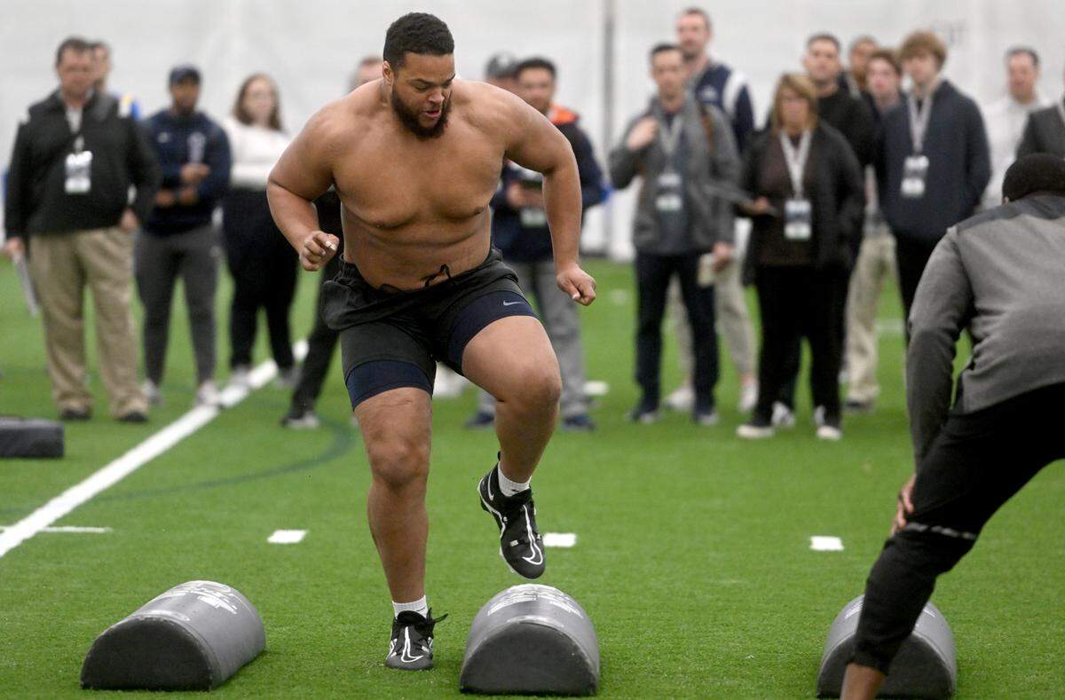 Defensive tackle PJ Mustipher runs a position drill during Penn State football’s Pro Day on Friday, March 24, 2023.