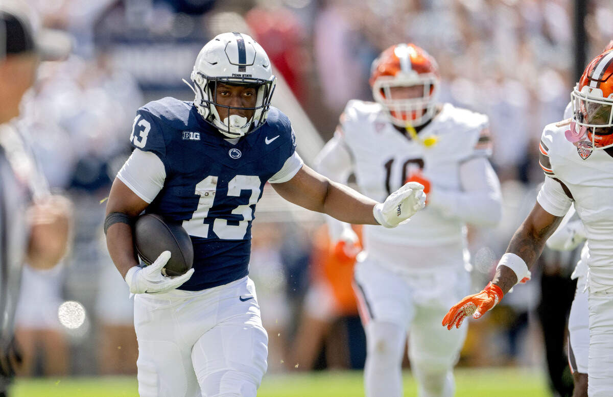 Penn State running back Kaytron Allen cuts down the field with the ball around Bowling Green defenders during the game on Saturday, Sept. 7, 2024.  