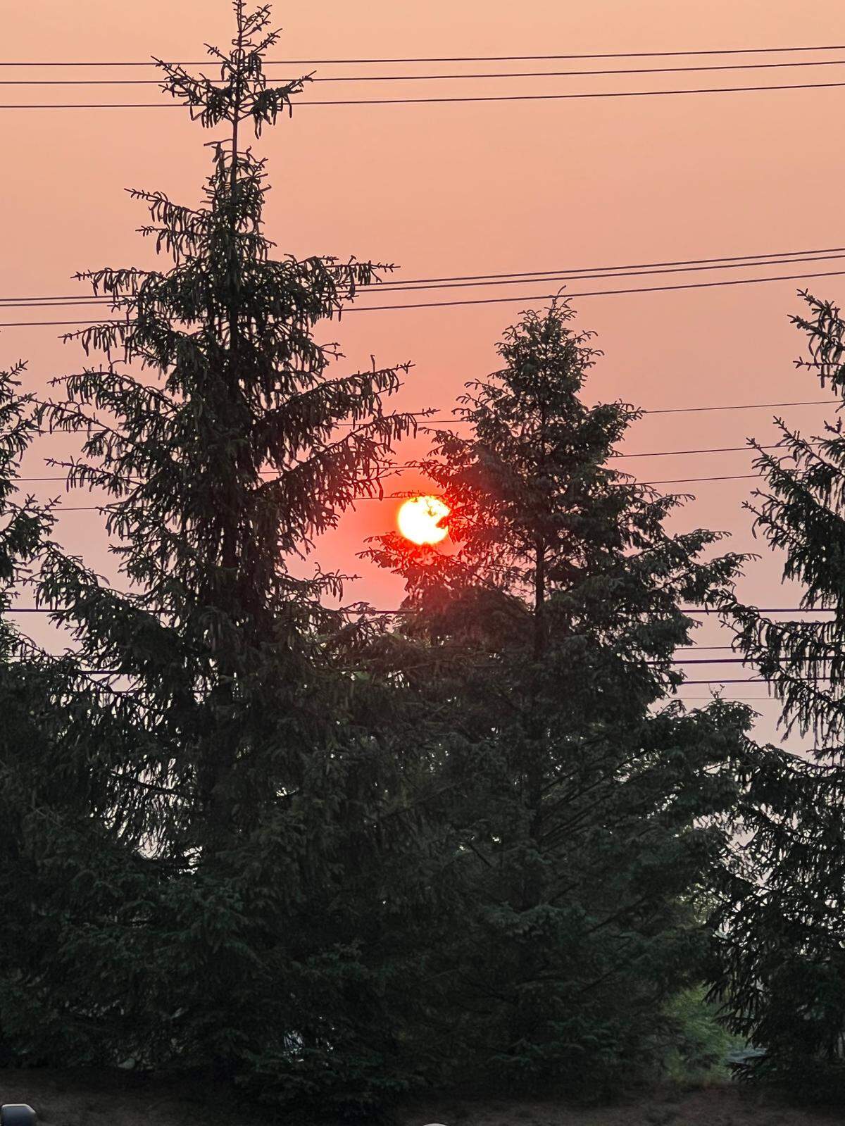 The sun rises in the smoky Ferguson Township sky on Wednesday, June 7, 2023.