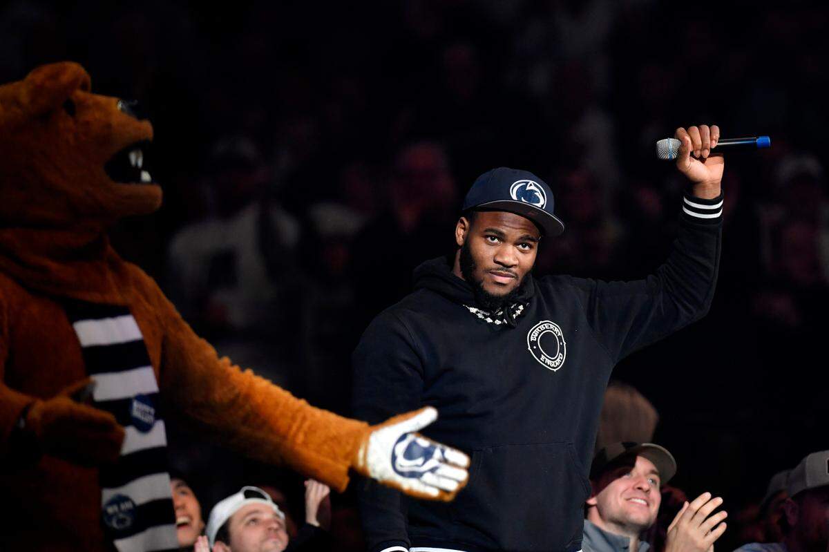 Former Penn State football star and current Dallas Cowboy Micah Parsons waves to the crowd during the wrestling match on Friday, Jan. 27, 2023 at the Bryce Jordan Center.