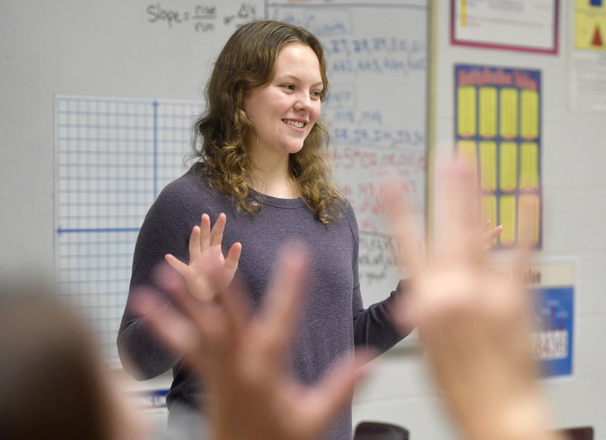 Melody Sharp signs a song with students in her mom Kim Sharp’s classroom at Bellefonte Middle School on Dec. 13. Melody, a senior at State High, completed her Girl Scout Gold Award by reaching out to teachers to get certified in American Sign Language and advocating for ASL to be taught in schools.