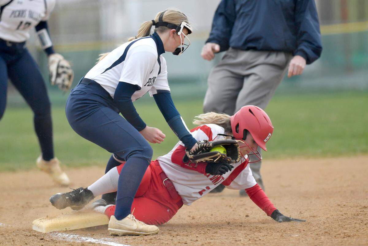 Bellefonte’s Tori Reichert safely steals third around Penns Valley’s Kailen Winkelblech during the game on Monday, April 4, 2022.