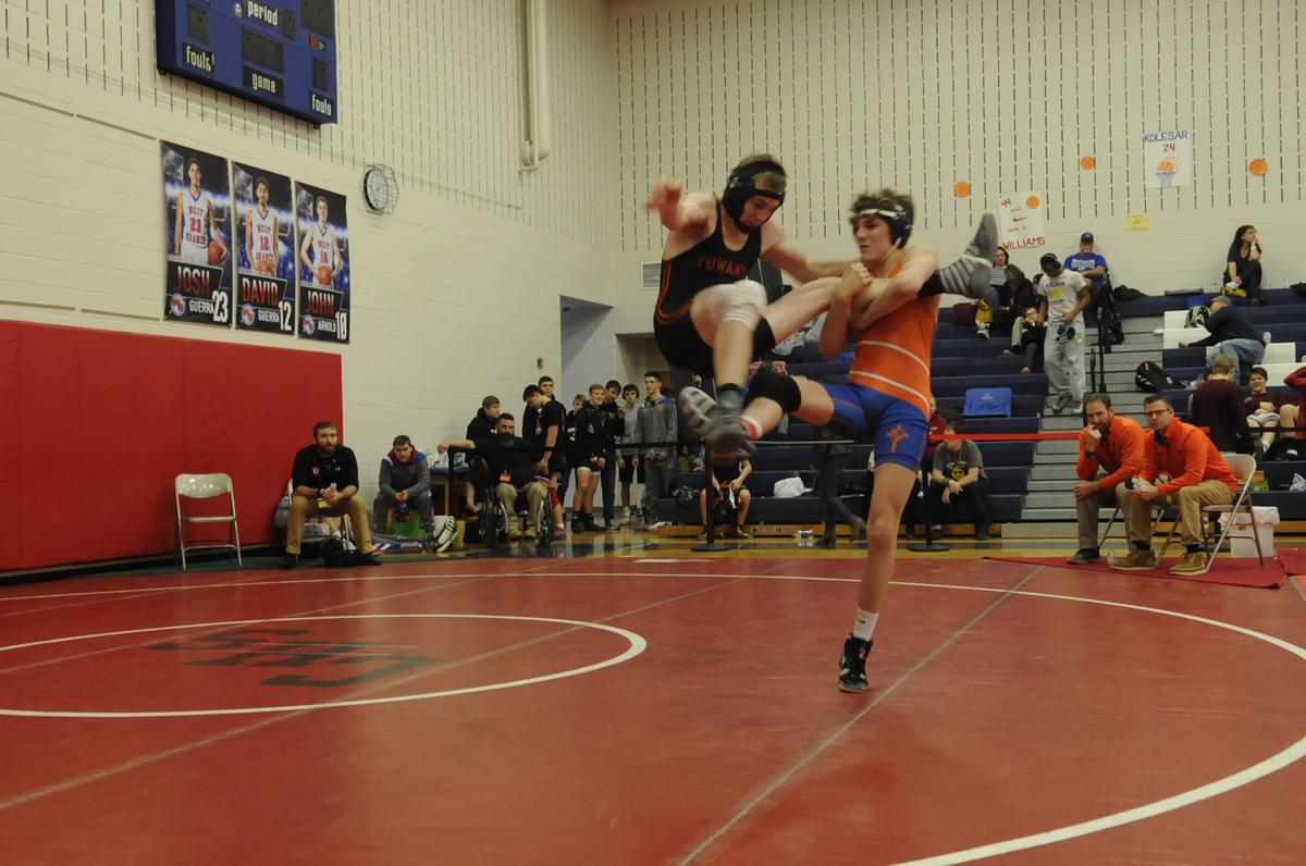 St. Joseph’s Catholic Academy’s Keegan Rothrock, right, looks to trip Towanda’s Riley Gowin to the mat in their 152-pound second round match of the Ultimate Warrior Tournament at West Branch High School in Allport on Friday, January 25, 2019. Rothrock pinned Gowin in 47 seconds.