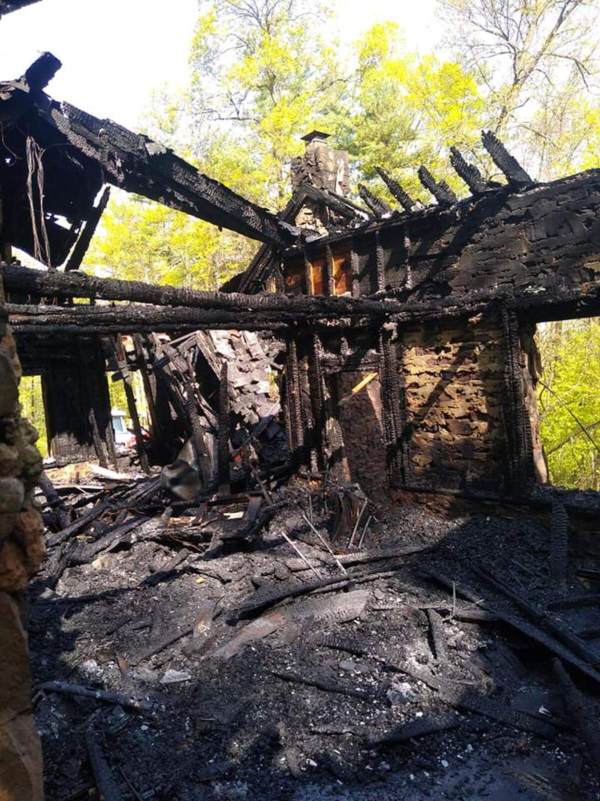 A fire that broke out Wednesday in the porch area of a house along the 700 block of Mountain Road in Harris Township destroyed a house that three adults were living in.