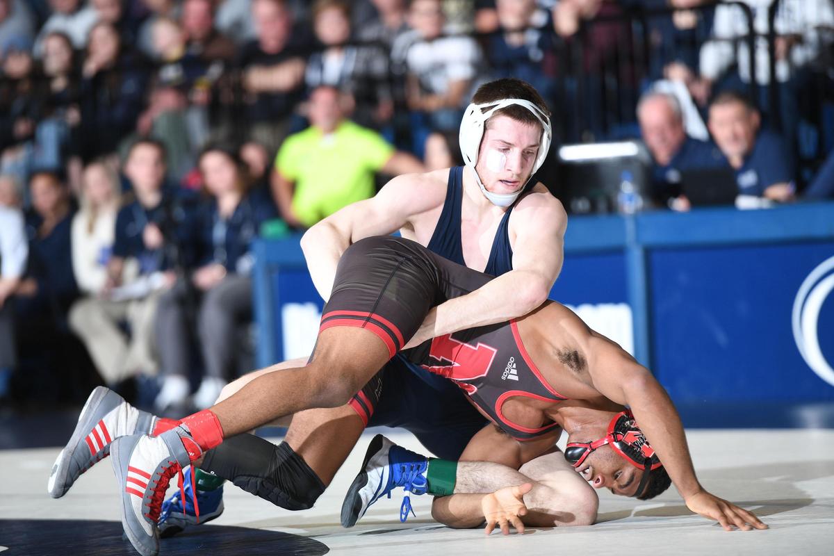 Penn State’s Nick Lee, 141 lbs (right) takes down Nebraska’s Chad Red Jr. Sunday at Rec. Hall. Lee edged Red, 5-4. Penn State defeated Nebraska, 25-6. (For the CDT/Steve Manuel)