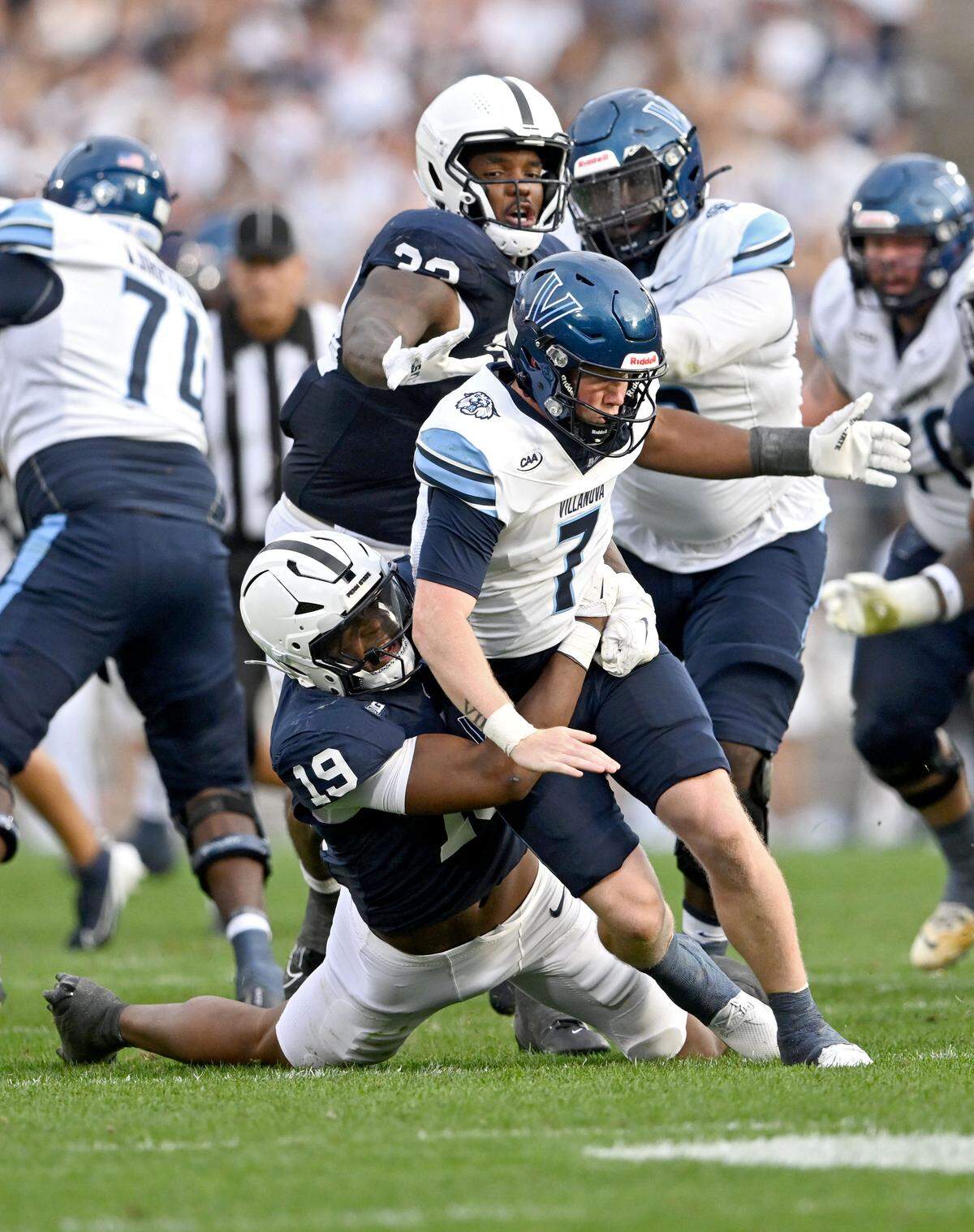 Penn State defensive end Chaz Coleman pulls down Villanova quarterback Pat McQuiade as he makes a pass during the game on Saturday, Sept. 13, 2025.  