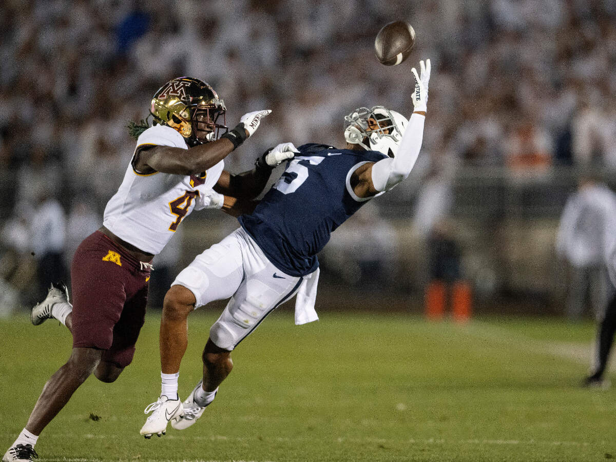 Penn State wide receiver Mitch Tinsley makes a catch around Minnesota’s Terell Smith during the game on Saturday, Oct. 22, 2022.