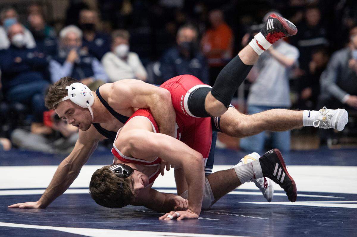 Penn State’s Brady Berge attempts a takedown on Rutgers’ Andrew Clark during a wrestling dual between Penn State and Rutgers on Sunday, Jan. 16, 2022 at Rec Hall in University Park, Pa. Penn State defeated the Scarlet Knights 27-11.