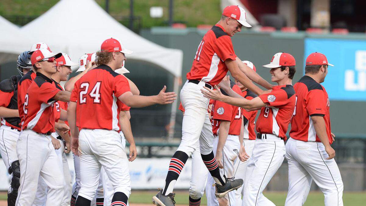 Bellefonte’s (41) Gavin Fravel leaps toward teammate Seth Shuey after winning the District 6 4A championship over Penn Cambria at Altoona’s People’s Natural Gas Field on Tuesday, June 1, 2021.