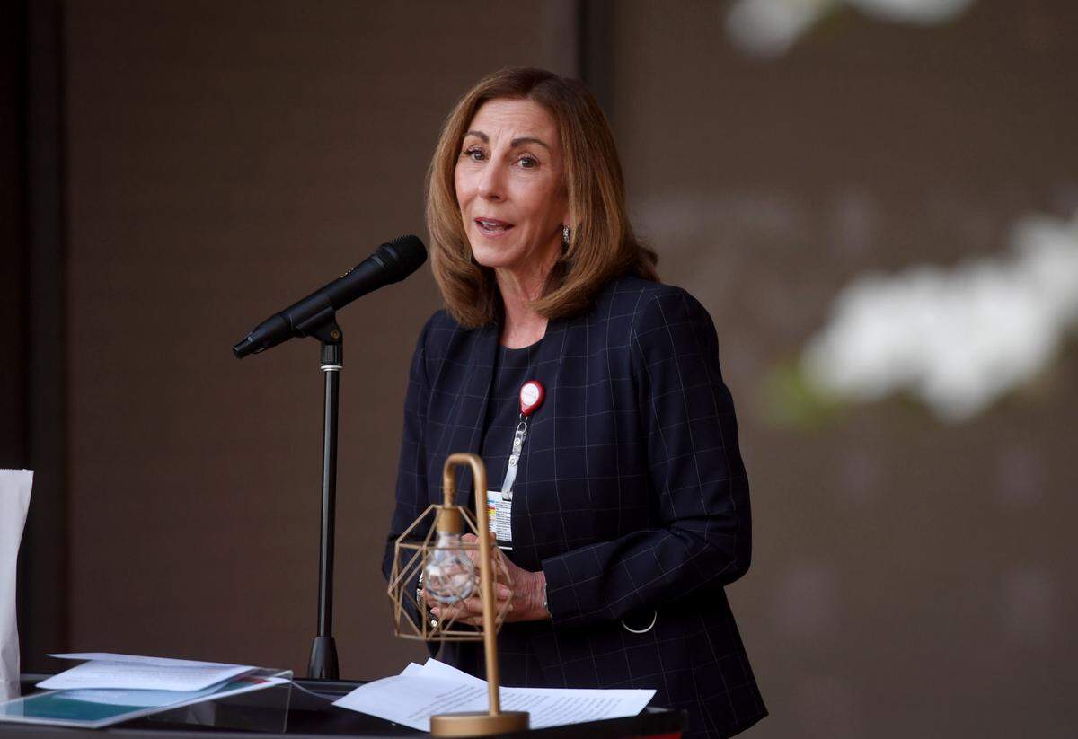 Kathleen Rhine, president and CEO of Mount Nittany Health, speaks during the “Luminary Reflection: An evening of Recognition, Remembrance, Gratitude and Hope,” on Monday.