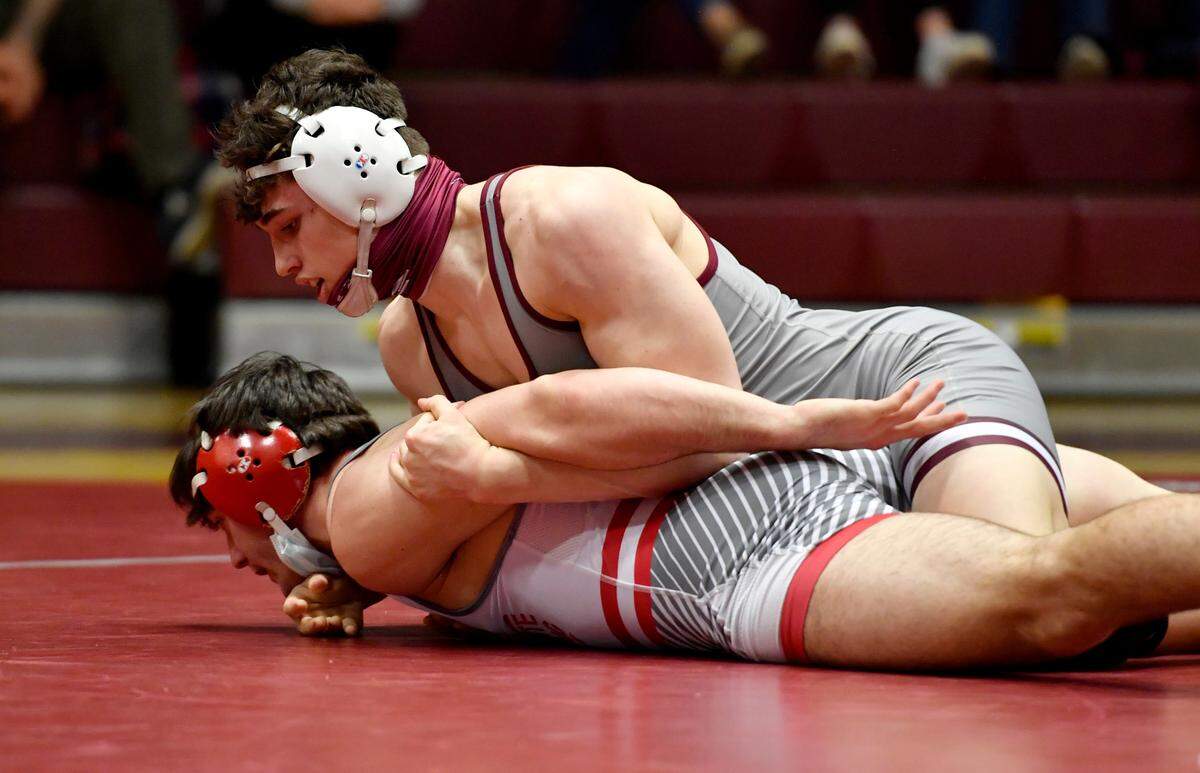 State College’s Lance Urbas controls Bellefonte’s Steven Ivicic in the 172 lb bout of the District 6 3A team championships on Thursday, March 18, 2021.