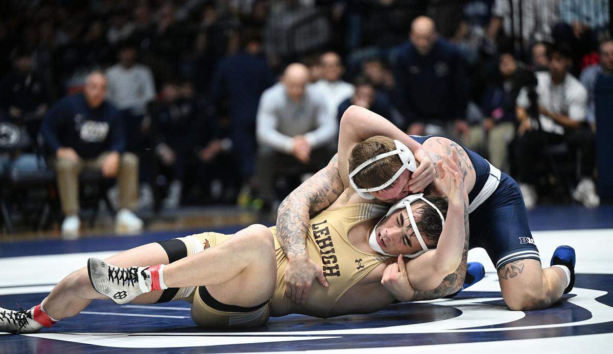Penn State's Rocco Welsh (top) maintains control over Lehigh's Rylan Rogers at 184 pounds during the Sunday, Dec. 7, 2025 match at Rec Hall in State College. Welsh defeated Rogers, 4-2. Penn State defeated Lehigh, 36-6.