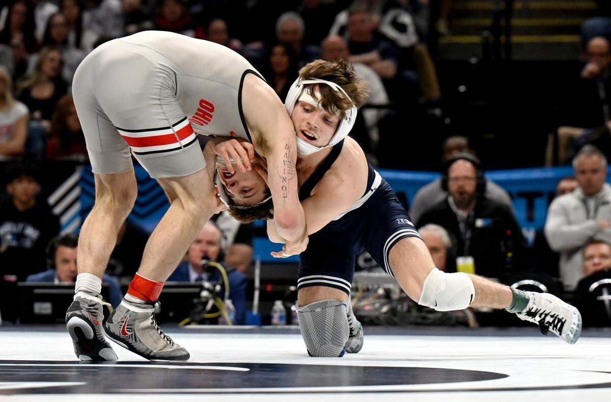 Penn State's Marcus Blaze wrestles Ohio State’s Ben Davino in the 133-pound championship bout of the Big Ten wrestling championships on Sunday, March 8, 2026.