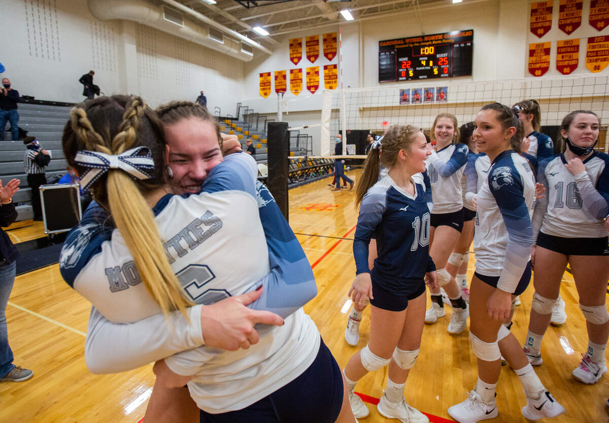 Philipsburg-Osceola’s London Cutler (22) hugs Jayden Perks (6) after their team defeated North Catholic High School in the PIAA Class 2A semifinal game in Cranberry Township on Tuesday, Nov. 17, 2020. The Lady Mounties won 3-2 and will play in the state championship on Saturday.