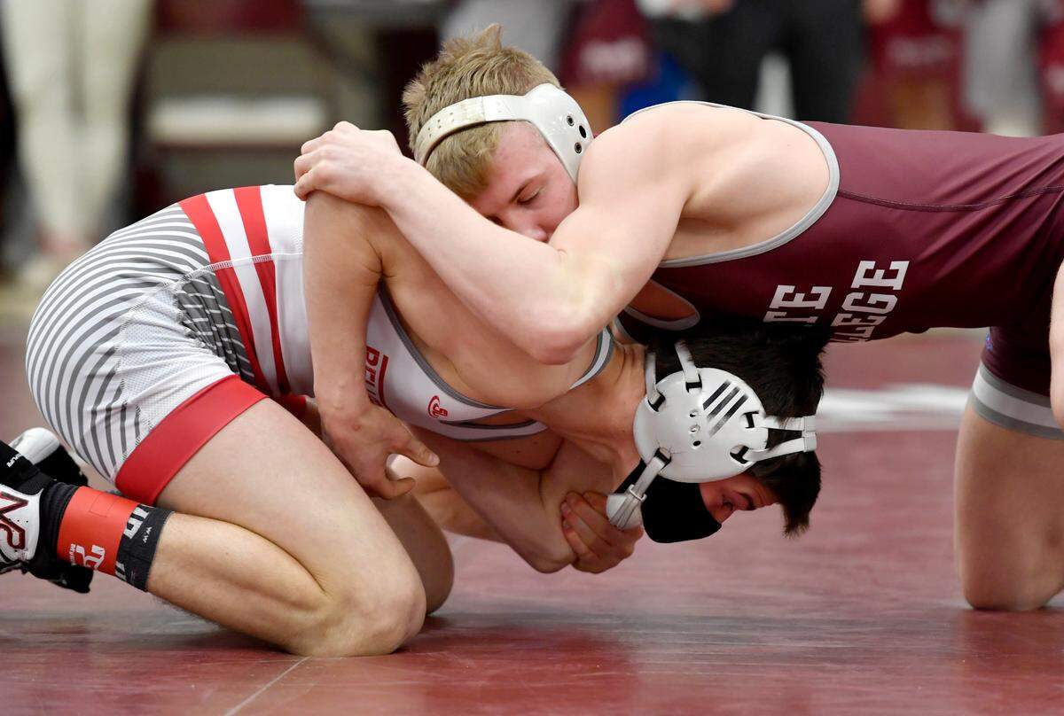 Bellefonte’s Jude Swisher and State College’s Pierson Manville wrestle in the 132 lb championship bout at the District 6 3A tournament on Friday, Feb. 19, 2021 at Altoona High School. Manville won by decision, 2-1.