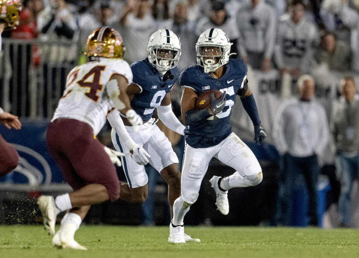 Penn State safety Ji’Ayir Brown runs with the ball after intercepting it during the game against Minnesota on Saturday, Oct. 22, 2022.