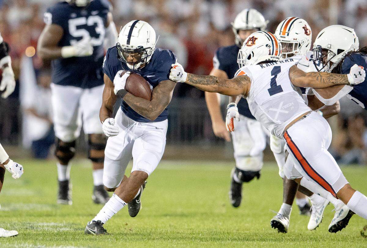 Penn State running back John Lovett cuts down the field with the ball from Auburn’s Donovan Kaufman.
