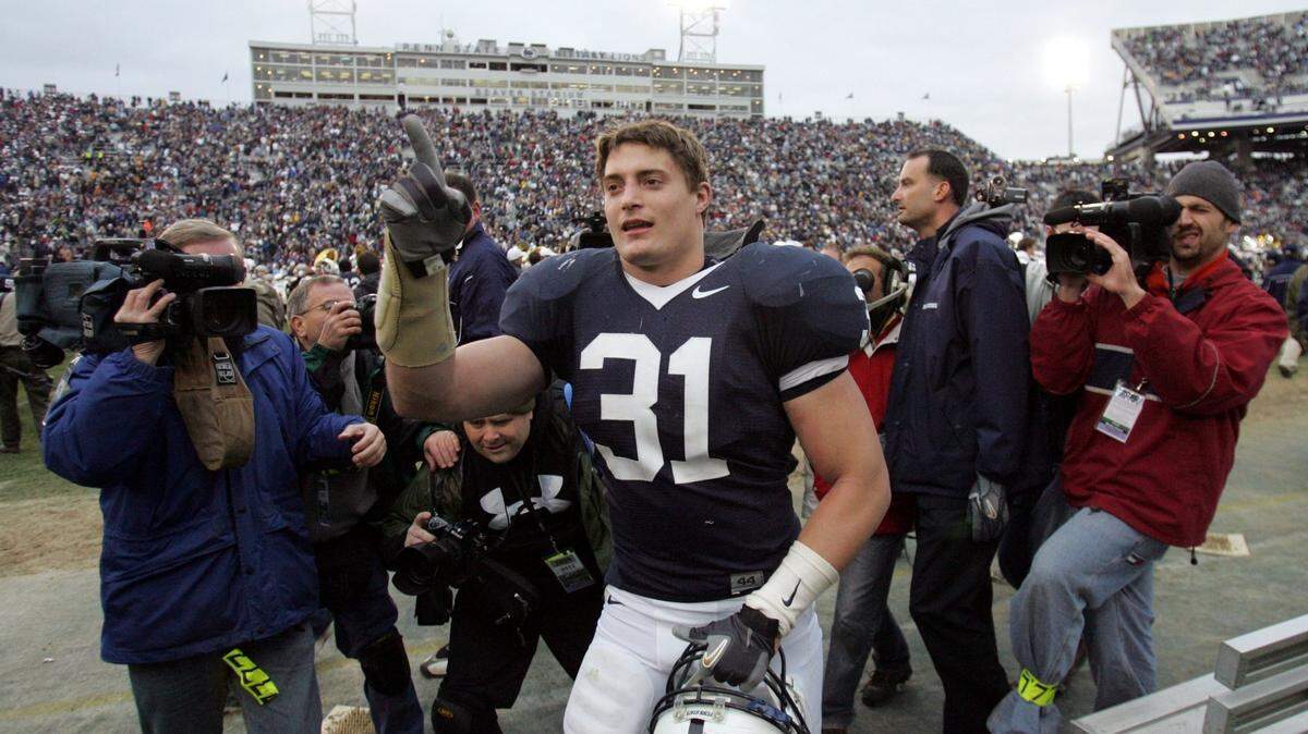 Linebacker Paul Posluszny walks toward the student section after the Nittany Lions’ win over Michigan State in 2006.