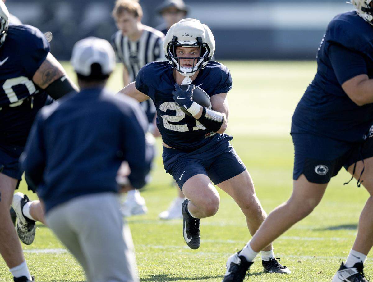 Penn State running back Carson Hansen cuts down the field with the ball during practice on Thursday, April 9, 2026.  