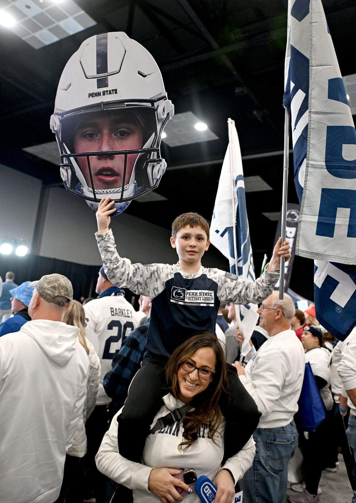 A fan holds a cut out of Drew Allar’s head as the Big Ten Tailgate show films at the Indianapolis Convention Center before the game on Saturday, Dec. 7, 2024.