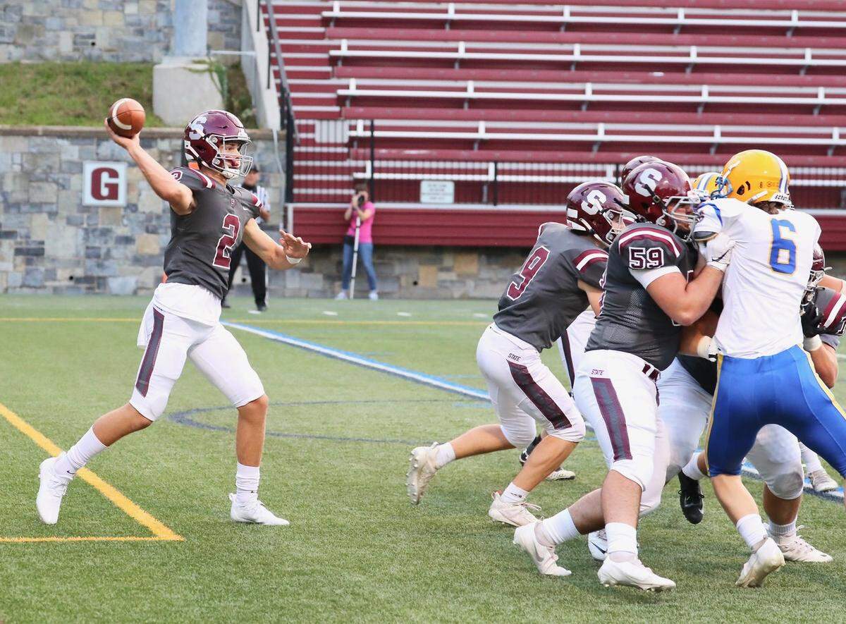 State College’s Finn Furmanek looks to make a pass on Friday, Sept. 3, 2021, against Downingtown East at Memorial Field.