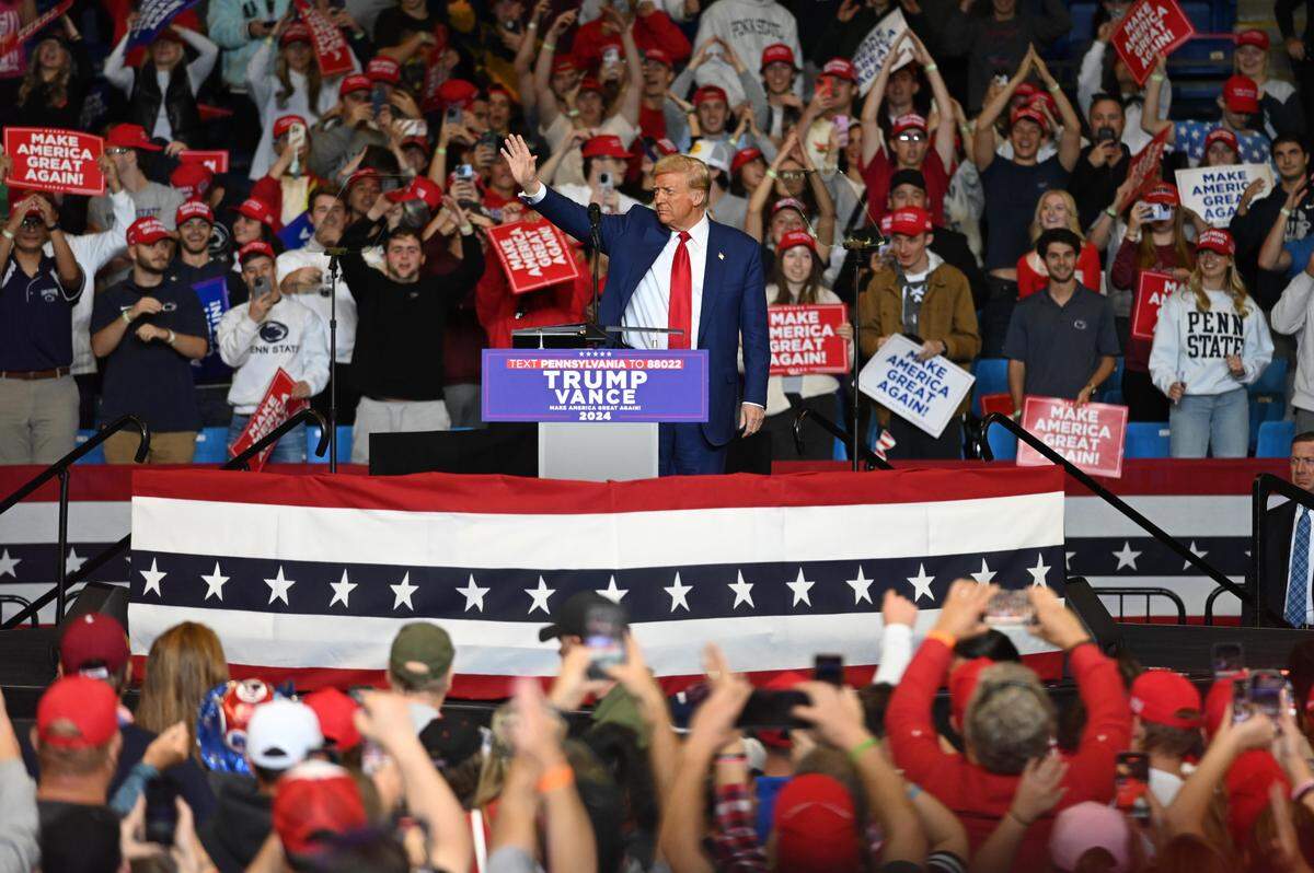 Donald Trump waves goodbye to the crowd after his rally at the Bryce Jordan Center on Saturday, Oct. 26, 2024.