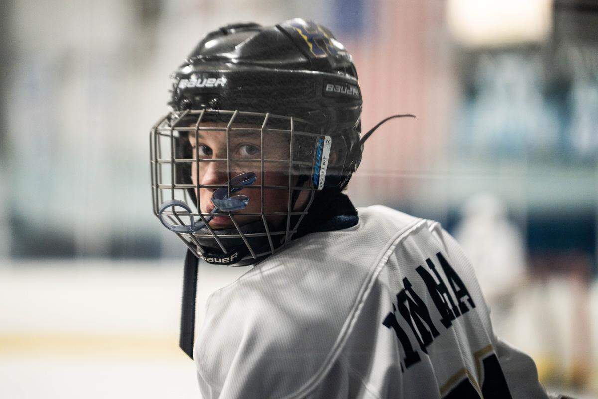 Hollidaysburg’s Clark Monahan looks on from the bench during an ice hockey game against State College on Tuesday, Feb. 17, 2026, in Hollidaysburg, Pa. The Little Lions defeated the Golden Tigers 4-1.