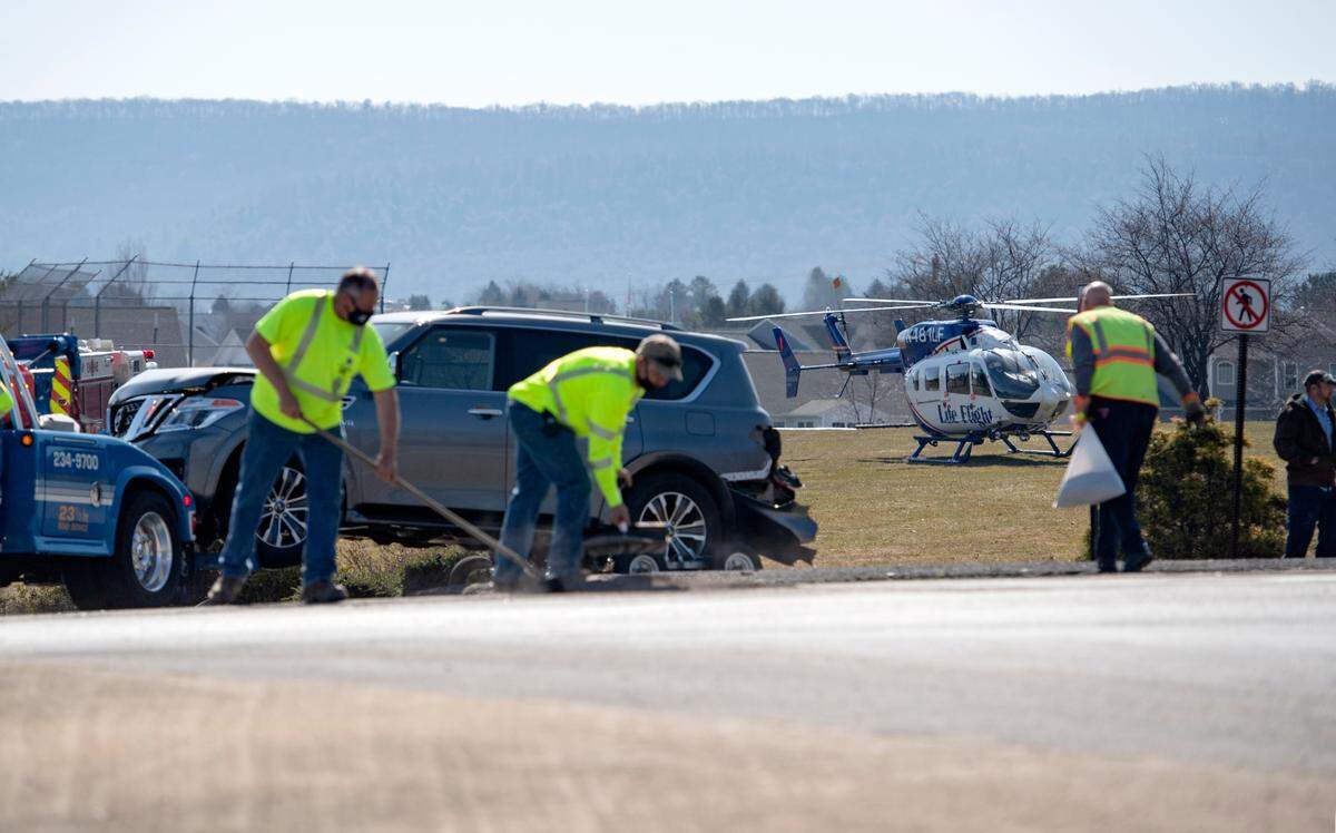 The Life Flight helicopter waits to take one patient from the scene of the a multi-vehicle accident at the intersection of West College Avenue and Science Park Road on Monday, March 22, 2021.