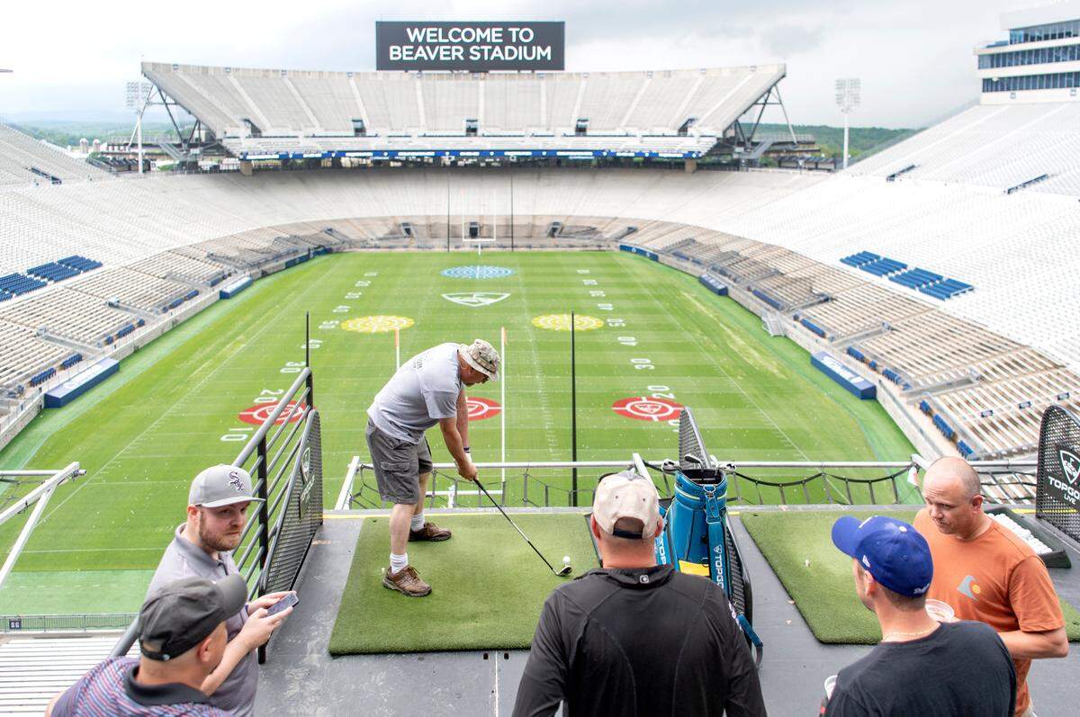 Friends participate in Topgolf Live at Beaver Stadium on Thursday, June 2, 2022.