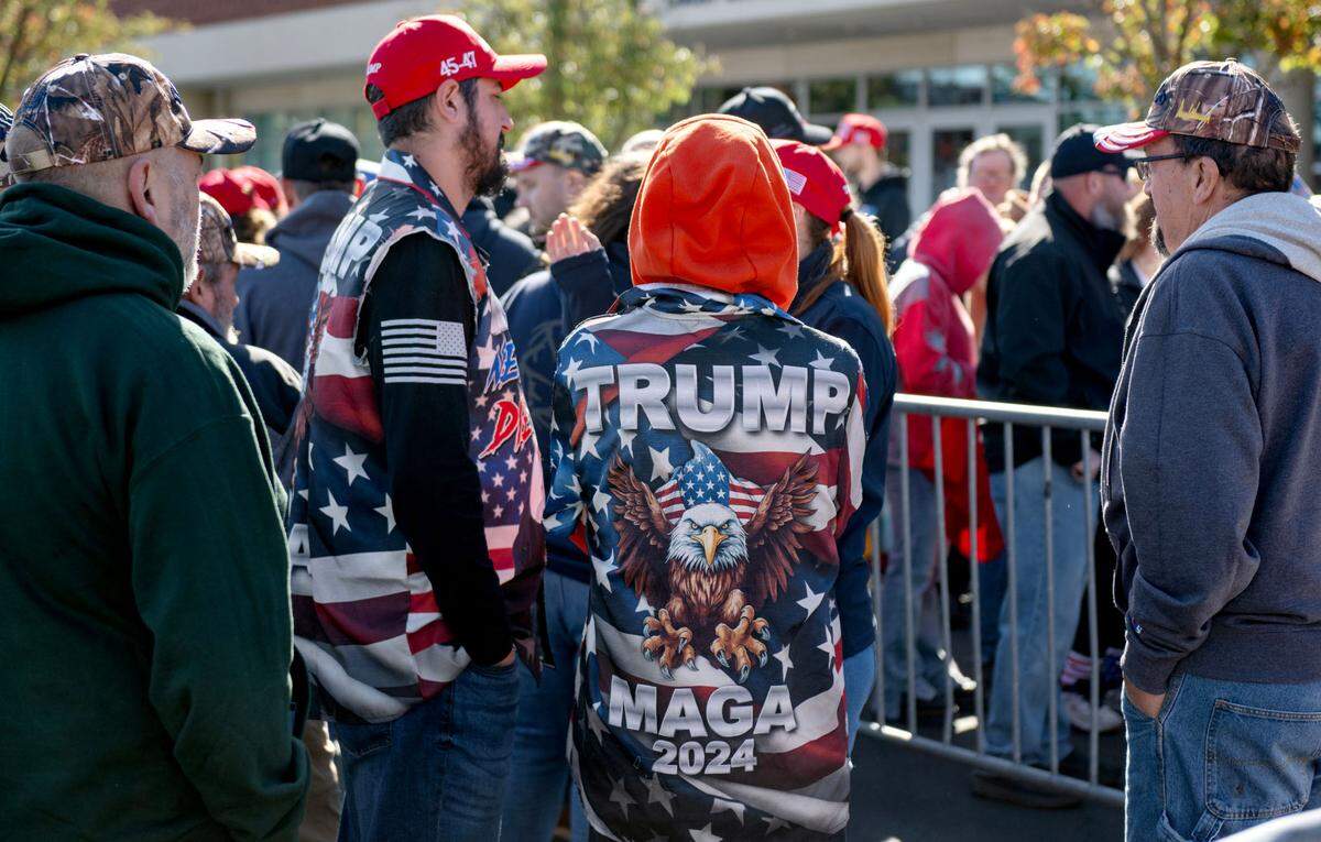 Trump supporters line up to enter the Bryce Jordan Center for a Trump rally on Saturday, Oct. 26, 2024.