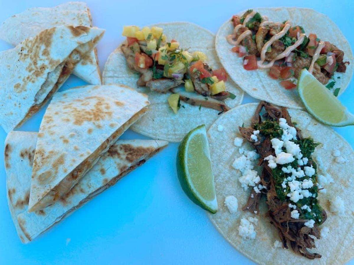 Offerings from Happy Valley TaCo Truck include a chicken quesadilla, jerk chicken taco with pineapple salsa, chicken taco with fresh pico and chipotle mayo, and a shredded beef carne asada topped with chimmichurri and queso fresco.
