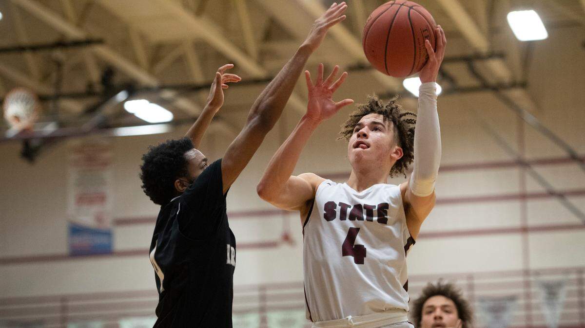 Braeden Shrewsberry shoots the ball during a high school basketball game between State High and Harrisburg on Tuesday in State College.