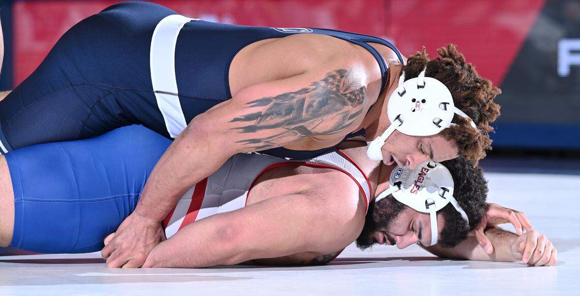 Penn State’s Greg Kerkvliet (top) holds down American’s Emmanuel Ulrich at heavyweight during Friday’s match at Rec. Hall in State College. Kerkvliet defeated Ulrich by pin-fall. Penn State defeated American University, 50-3. (For the CDT/Steve Manuel)