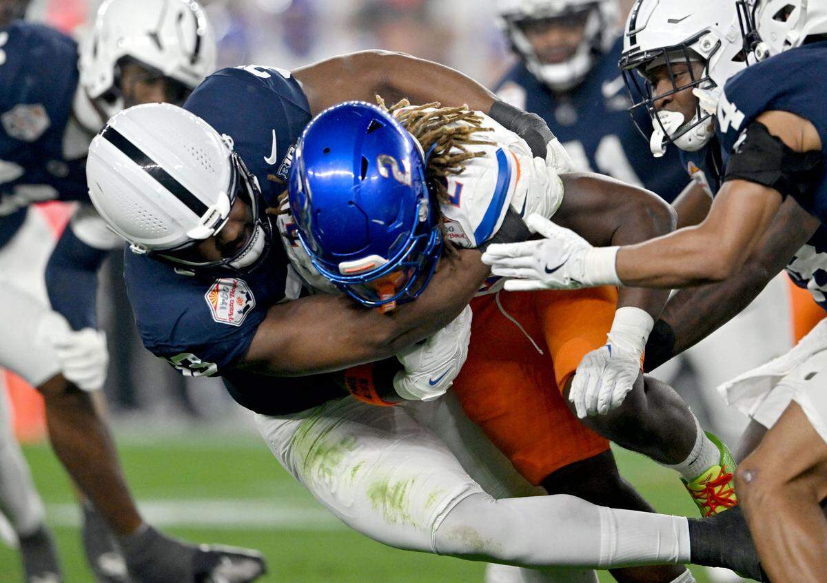 Penn state defensive end Dani Dennis-Sutton stops Boise State running back Ashton Jeanty during the Fiesta Bowl on Tuesday, Dec. 31, 2024 at State Farm Stadium.