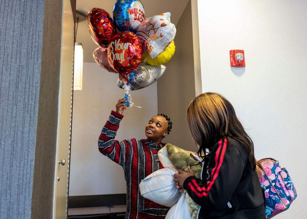 Rachel Bridgeman, left, and her sister Sarah, right, celebrated Rachel’s release from Allegheny County Jail. It took a cooperative, community-based effort to help free Rachel after she was deemed incompetent to stand trial.